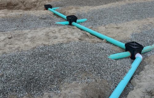 Septic drainage pipe system being installed underground