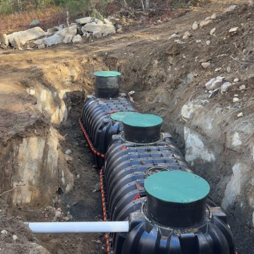 Underground septic tank installation at residential property